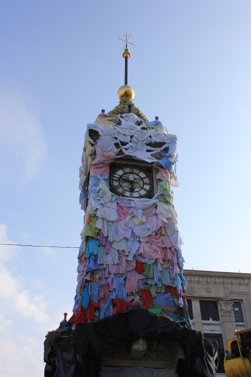The clock all dressed up in t-shirts for Brighton Festival